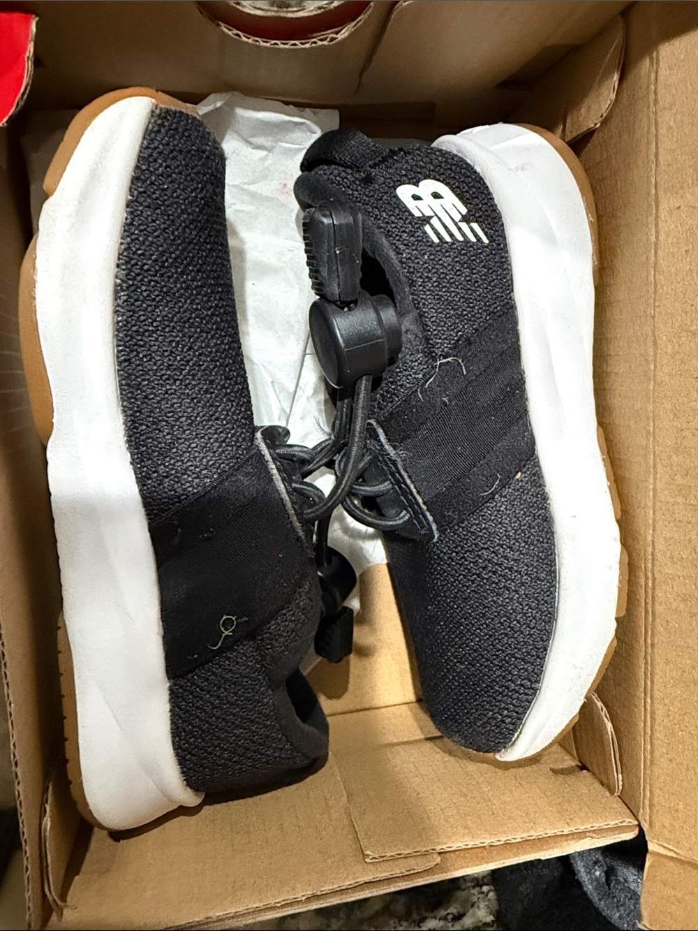 New Balance Kids Black and White Slip-On Sneakers